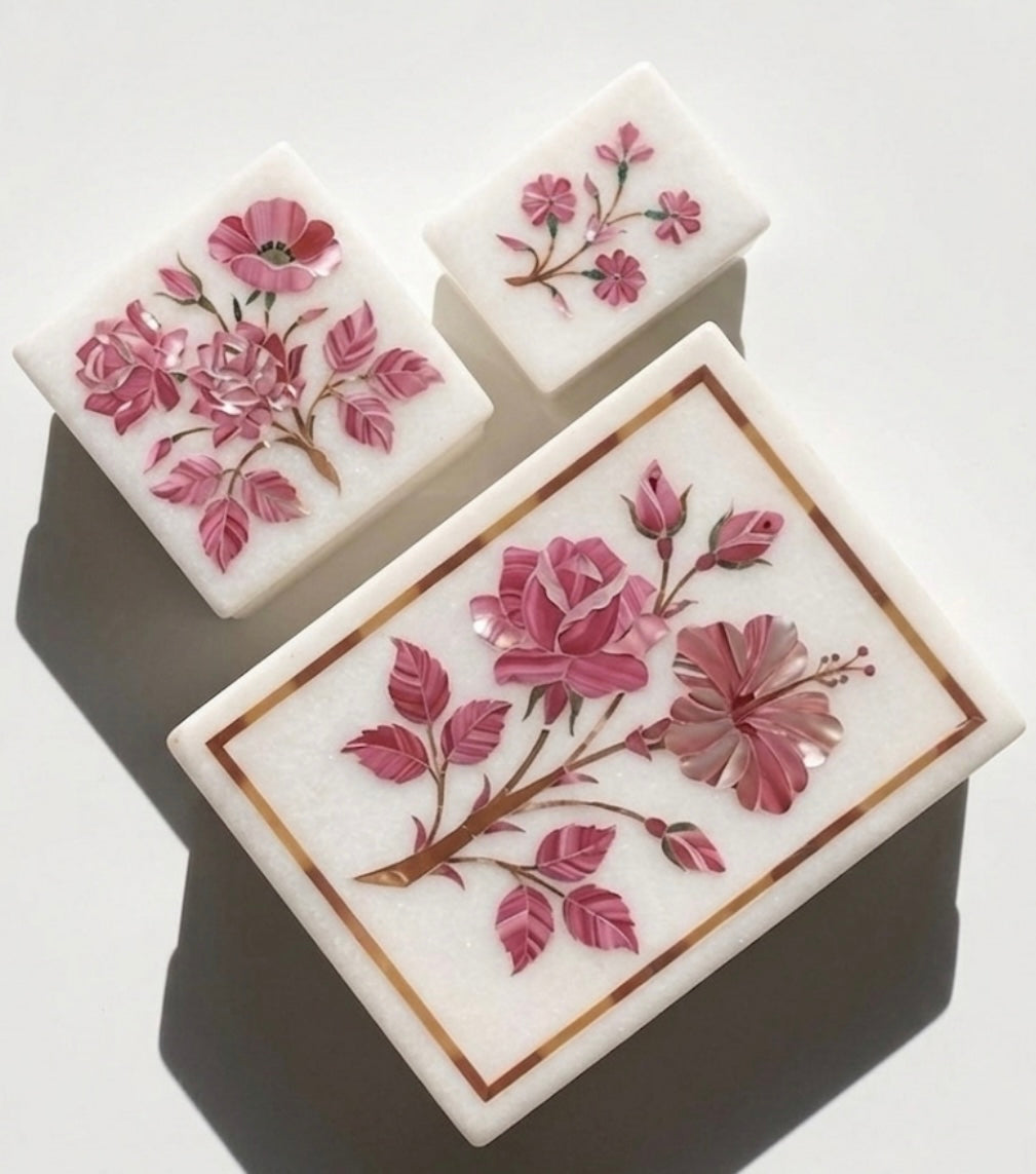 Vyasaara - Decorative tiles with floral designs on a white background