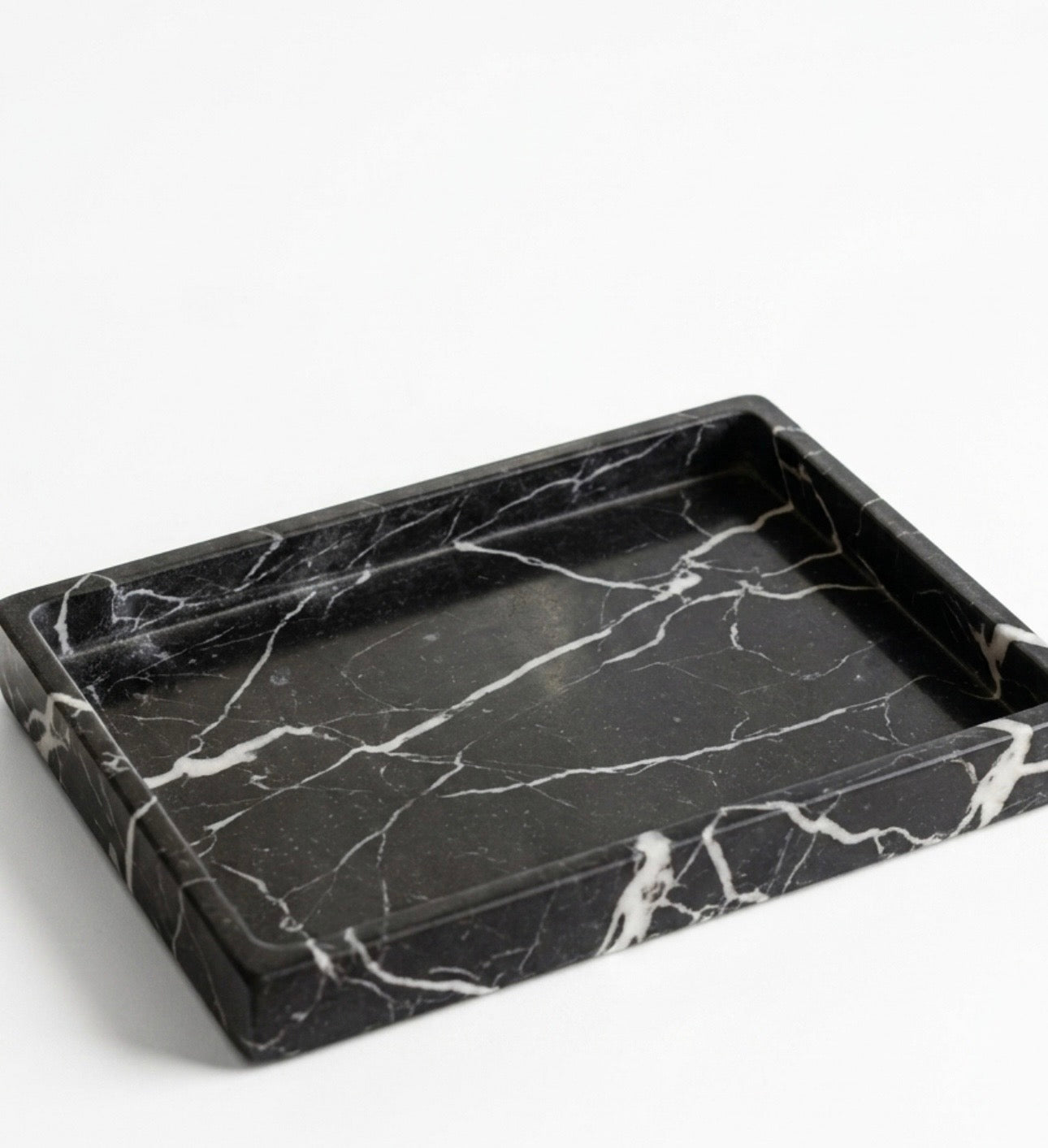 Black marble tray on a white background