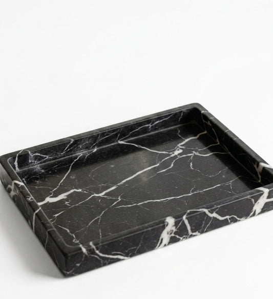 Black marble tray on a white background